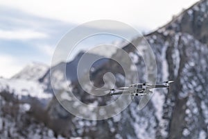 Drone quadcopter with digital camera in flight