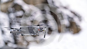 Drone quadcopter with digital camera in flight
