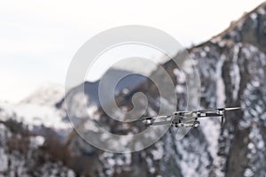 Drone quadcopter with digital camera in flight