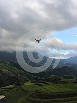 Drone quadcopter digital camera while flying over the longji terrace