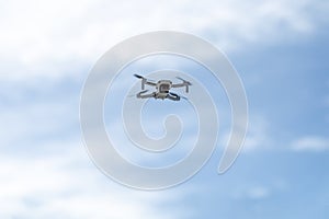 Drone. The quadcopter flies in the sky. Minidrone in flight.