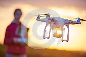 Drone quadcopter flying at sunset photo