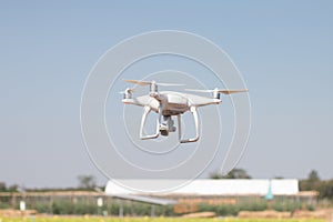 Drone quadcopter hover on sky background,drone camera,in farm