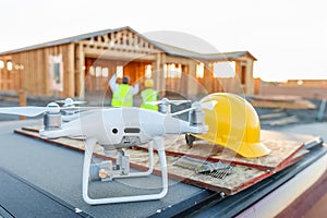 Drone Quadcopter Next to Hard Hat Helmet At Construction Site
