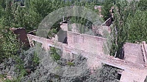 Drone quadrocopter explores an abandoned industrial building.