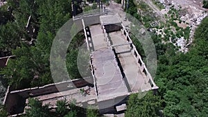 Drone quadrocopter explores an abandoned industrial building.