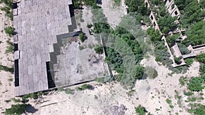 Drone quadrocopter explores an abandoned industrial building.