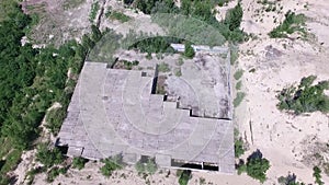 Drone quadrocopter explores an abandoned industrial building.