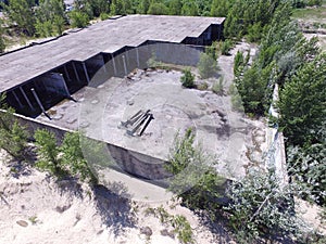 Drone quadrocopter explores an abandoned industrial building.