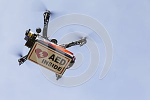 Drone quadrocopter transporting box with AED