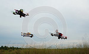 Drone racing over the green field