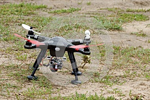 A drone is ready to fly and hovered above the ground before the race