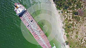 Drone Rotates over Aground Tanker at Azure Ocean Beach