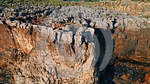 Drone rough stony rocks under summer sunlight. Dangerous cliff rugger stones. photo