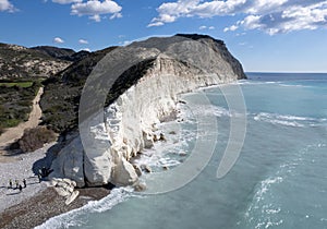 Drone scenery of Unrecognized people relaxing at the beach after hiking the white cliffs. People active outdoors. photo