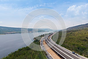 Drone shot aerial view landscape of under construction motorway tolls near big natural river