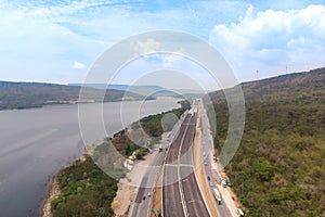 Drone shot aerial view landscape of under construction motorway tolls near big natural river