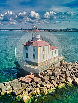 Drone shot of the Ashtabula Harbor Light building under a cloudy sky in Ohio, USA