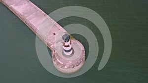 Drone shot circling above Seaham lighthouse and pier in 4k, Durham, UK