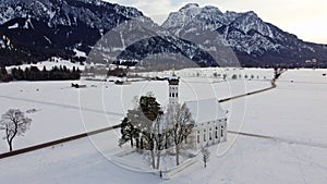 Drone shot of the famous baroque Colomanskirche near Schwangau in Bavaria in winter