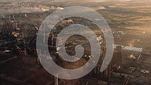 Drone shot of industrial zone with chimneys and smog, air pollution