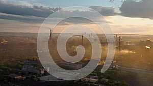 Drone shot of industrial zone with tubes and smog, air pollution