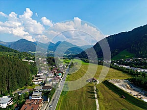 Drone shot made over Kitzbuhel, Tyrol, Austria, with a view of the mountains and the main street