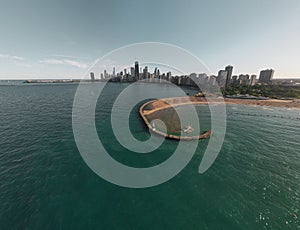 Drone shot of the North Avenue Beach in Lincolns park in Chicago against the cityscape skyline