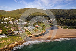 Drone shot over green Stanwell park beach on a sunny day