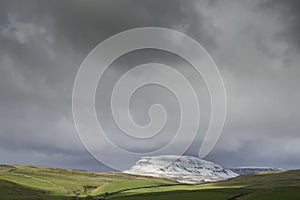 Drone shot of penyghent covered in snow