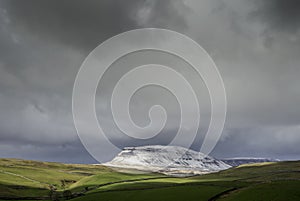 Drone shot of penyghent covered in snow