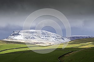 Drone shot of penyghent covered in snow