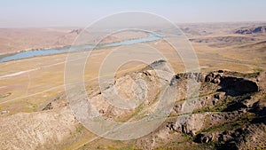 Drone shot of river Ili and spring steppe in Kazakhstan