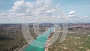 Drone shot of river Ili and spring steppe in Kazakhstan