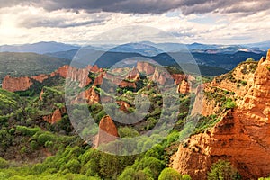 Drone shot of Roman gold mines of the marrows with cloudy sky in Leon, northern Spain