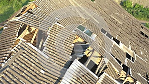 Drone shot of the roof of an abandoned cattle barn.