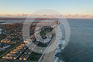 Drone shot of Sea Bright, New Jersey, and the Atlantic Ocean at sunset