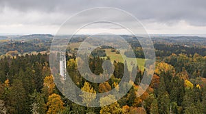 Drone shot of the Suur Munamagi Tower in Haanja, Estonia, surrounded by autumn forest