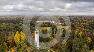 Drone shot of the Suur Munamagi Tower in Haanja, Estonia, surrounded by autumn forest