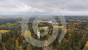 Drone shot of the Suur Munamagi Tower in Haanja, Estonia, surrounded by autumn forest