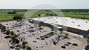 Drone shot of Walmart Supermarket. Parking Lot of Consumers Shopping. Naperville IL. USA 17 april 2023