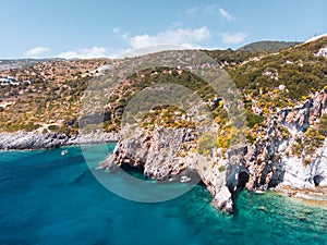 Drone shot of Zakynthos island with beautiful turquoise Ionian sea and limestone cliffs near famous Navagio beach during daytime