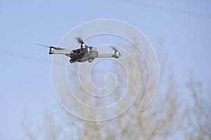 drone on sky background. Radio-controlled quadrocopter is filming nature. Unmanned flying toys