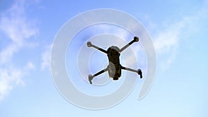 Drone, sky and flight of helicopter in air outdoor, spy or video surveillance electronics. UAV, machine flying and