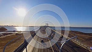 Drone span over high-speed road towards the new cable-stayed bridge in the early morning, northwest high-speed diameter