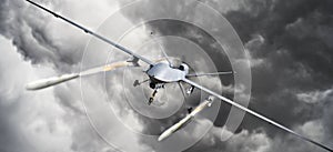 Drone strike .Front view of an unmanned aerial vehicle UAV military drone firing missile rockets at a target . photo