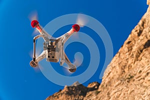 The drone in the sunset sky. ocean wave mountains Close up of quadrocopter outdoors. concept for film maker wedding videography