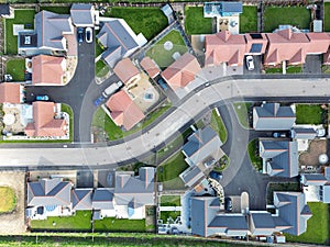 Drone top down view of detached bungalows in a new development in the UK.