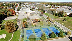 Drone video, flying near the Riviere-Nord public park in St-Eustache at the beginning of Autumn revealing the Arc-en-ciel school,