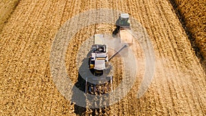 Drone view of agriculture machinery working the fields